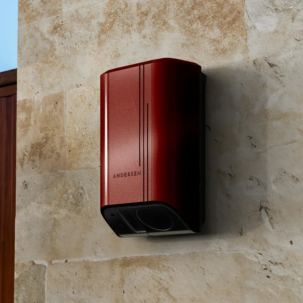 Andersen Quartz EV charger mounted on an exterior wall, showing its compact design-led finish.